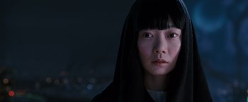 Movie still from “Cloud Atlas” (2012), directed by Lilly Wachowski – A woman with a black veil on her head; Close Up shot, Over the shoulder angle