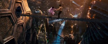 Movie still from “Cloud Atlas” (2012), directed by Lilly Wachowski – A man and a woman standing on top of a building; Extreme Wide shot, Overhead angle