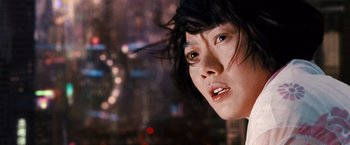 Movie still from “Cloud Atlas” (2012), directed by Lilly Wachowski – A person with long black hair; Close Up shot, Low angle
