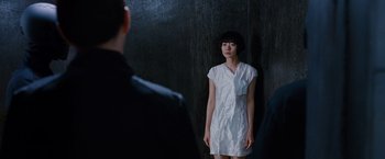 Movie still from “Cloud Atlas” (2012), directed by Lilly Wachowski – A woman standing in front of a man in front of a black wall; Medium shot, Over the shoulder angle