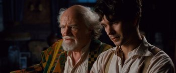 Movie still from “Cloud Atlas” (2012), directed by Lilly Wachowski – A man with a beard and a man with long hair; Close Up shot, Over the shoulder angle