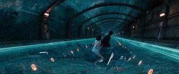 Movie still from “Cloud Atlas” (2012), directed by Lilly Wachowski – A man and a woman are walking in a tunnel; Wide shot, High angle
