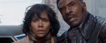 Movie still from “Cloud Atlas” (2012), directed by Lilly Wachowski – A man and a woman standing next to each other; Close Up shot, Low angle