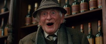 Movie still from “Cloud Atlas” (2012), directed by Lilly Wachowski – An old man wearing a hat and a scarf; Close Up shot, Low angle