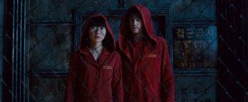 Movie still from “Cloud Atlas” (2012), directed by Lilly Wachowski – A couple of people standing next to each other; Medium shot, Low angle