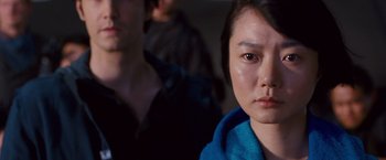 Movie still from “Cloud Atlas” (2012), directed by Lilly Wachowski – A person wearing a blue towel; Close Up shot, Over the shoulder angle
