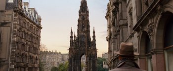Movie still from “Cloud Atlas” (2012), directed by Lilly Wachowski – A man standing in front of an ornate building; Extreme Wide shot, Low angle