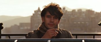 Movie still from “Cloud Atlas” (2012), directed by Lilly Wachowski – A man with a scarf on his head and a ring on his finger; Close Up shot, Over the shoulder angle