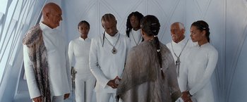 Movie still from “Cloud Atlas” (2012), directed by Lilly Wachowski – A group of people standing next to each other; Medium shot, Low angle