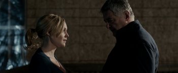 Movie still from “Clown” (2014), directed by Jon Watts – A man and a woman standing next to each other in front of a brick wall; Close Up shot, Over the shoulder angle