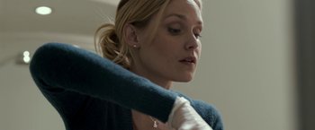 Movie still from “Clown” (2014), directed by Jon Watts – A person holding a sweater; Close Up shot, High angle