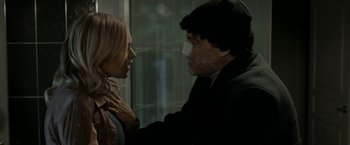 Movie still from “Clown” (2014), directed by Jon Watts – A man and a woman face to face in front of a window; Close Up shot, Over the shoulder angle