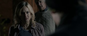 Movie still from “Clown” (2014), directed by Jon Watts – A woman standing next to a man in a room; Close Up shot, Over the shoulder angle