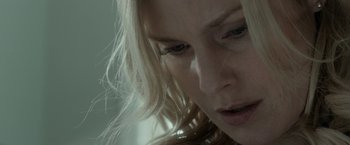Movie still from “Clown” (2014), directed by Jon Watts – A woman's face as she looks down; Extreme Close Up shot, Low angle