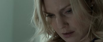 Movie still from “Clown” (2014), directed by Jon Watts – A woman's face with long blonde hair; Extreme Close Up shot, Low angle
