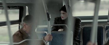 Movie still from “Clown” (2014), directed by Jon Watts – A man with a face paint sitting on a bus; Medium shot, Over the shoulder angle