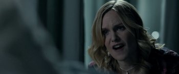 Movie still from “Clown” (2014), directed by Jon Watts – A person sitting in front of a computer; Close Up shot, Over the shoulder angle