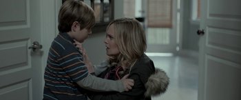 Movie still from “Clown” (2014), directed by Jon Watts – A woman and a boy are looking at each other; Close Up shot, Over the shoulder angle
