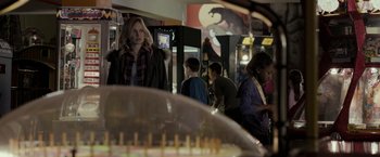 Movie still from “Clown” (2014), directed by Jon Watts – A group of people standing in a room; Medium shot, Over the shoulder angle