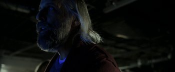 Movie still from “Clown” (2014), directed by Jon Watts – A person with long white hair; Close Up shot, Low angle