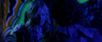 Movie still from “Clown” (2014), directed by Jon Watts – A person with long blonde hair; Close Up shot, Over the shoulder angle