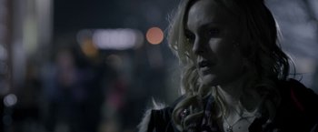 Movie still from “Clown” (2014), directed by Jon Watts – A woman with blonde hair is looking at the camera; Close Up shot, Over the shoulder angle