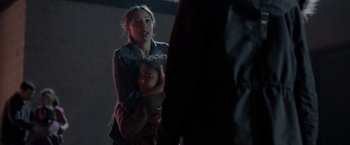Movie still from “Clown” (2014), directed by Jon Watts – A woman holding a child in her arms; Close Up shot, Over the shoulder angle