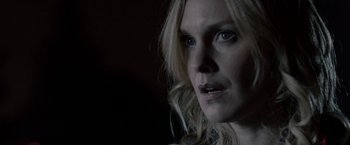 Movie still from “Clown” (2014), directed by Jon Watts – A person with long blonde hair; Close Up shot, Over the shoulder angle