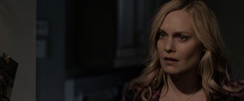 Movie still from “Clown” (2014), directed by Jon Watts – A woman with blonde hair is looking at the camera; Close Up shot, Over the shoulder angle