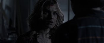 Movie still from “Clown” (2014), directed by Jon Watts – A person with blood on their face; Close Up shot, Over the shoulder angle