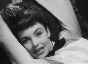 Movie still from “Cluny Brown” (1946), directed by Ernst Lubitsch – An old black and white photo of a woman laying in bed; Close Up shot, Overhead angle