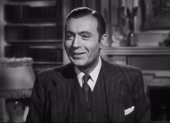 Movie still from “Cluny Brown” (1946), directed by Ernst Lubitsch – An older man in a suit and tie; Close Up shot, Low angle