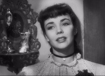 Movie still from “Cluny Brown” (1946), directed by Ernst Lubitsch – A black - and - white photo of a young woman; Close Up shot, Low angle