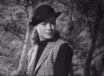 Movie still from “Cluny Brown” (1946), directed by Ernst Lubitsch – A black and white photo of a woman wearing a hat; Medium shot, Low angle