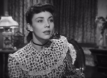 Movie still from “Cluny Brown” (1946), directed by Ernst Lubitsch – An old photo of a woman in a dress holding a mirror; Close Up shot, Low angle