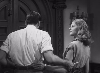 Movie still from “Cluny Brown” (1946), directed by Ernst Lubitsch – A man and a woman holding hands while standing next to each other; Medium shot, Low angle