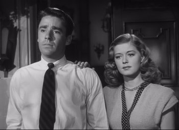 Movie still from “Cluny Brown” (1946), directed by Ernst Lubitsch – A man and a woman standing next to each other; Medium shot, Low angle