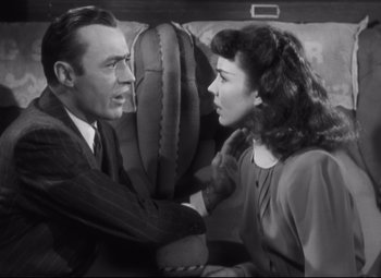 Movie still from “Cluny Brown” (1946), directed by Ernst Lubitsch – A man and a woman are sitting on a couch; Medium shot, High angle