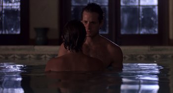 Movie still from “Cocoon” (1985), directed by Ron Howard – A man and a woman in a pool of water; Close Up shot, Over the shoulder angle