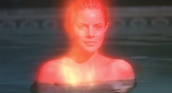 Movie still from “Cocoon” (1985), directed by Ron Howard – A beautiful young lady in a body of water; Close Up shot, High angle