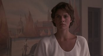Movie still from “Cocoon” (1985), directed by Ron Howard – A young man in a white shirt is looking at the camera; Close Up shot, Over the shoulder angle