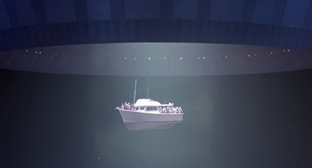 Movie still from “Cocoon” (1985), directed by Ron Howard – A boat floating on top of a body of water at night; Extreme Wide shot, High angle