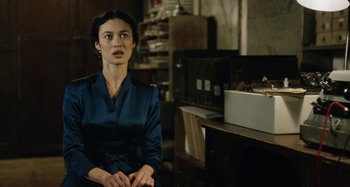 Movie still from “The Death of Stalin” (2017), directed by Armando Iannucci – A woman sitting in front of a computer desk; Medium shot, Over the shoulder angle