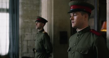 Movie still from “The Death of Stalin” (2017), directed by Armando Iannucci – A couple of men standing next to each other in uniforms; Medium shot, Low angle