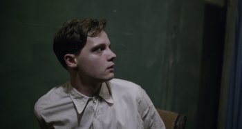 Movie still from “The Death of Stalin” (2017), directed by Armando Iannucci – A man in a white shirt looking to his left; Close Up shot, Over the shoulder angle