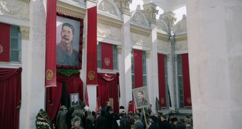 Movie still from “The Death of Stalin” (2017), directed by Armando Iannucci – A crowd of people gathered in front of a building; Wide shot, High angle
