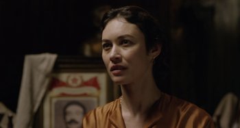 Movie still from “The Death of Stalin” (2017), directed by Armando Iannucci – A person wearing a brown shirt; Close Up shot, Over the shoulder angle