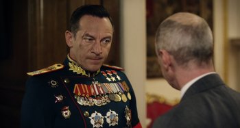 Movie still from “The Death of Stalin” (2017), directed by Armando Iannucci – A man in a military uniform talking to another man in a suit; Close Up shot, Over the shoulder angle