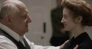 Movie still from “The Death of Stalin” (2017), directed by Armando Iannucci – An older man and a younger woman looking at each other; Close Up shot, Over the shoulder angle