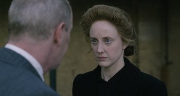 Movie still from “The Death of Stalin” (2017), directed by Armando Iannucci – An older man and a young woman are looking at each other; Close Up shot, Over the shoulder angle